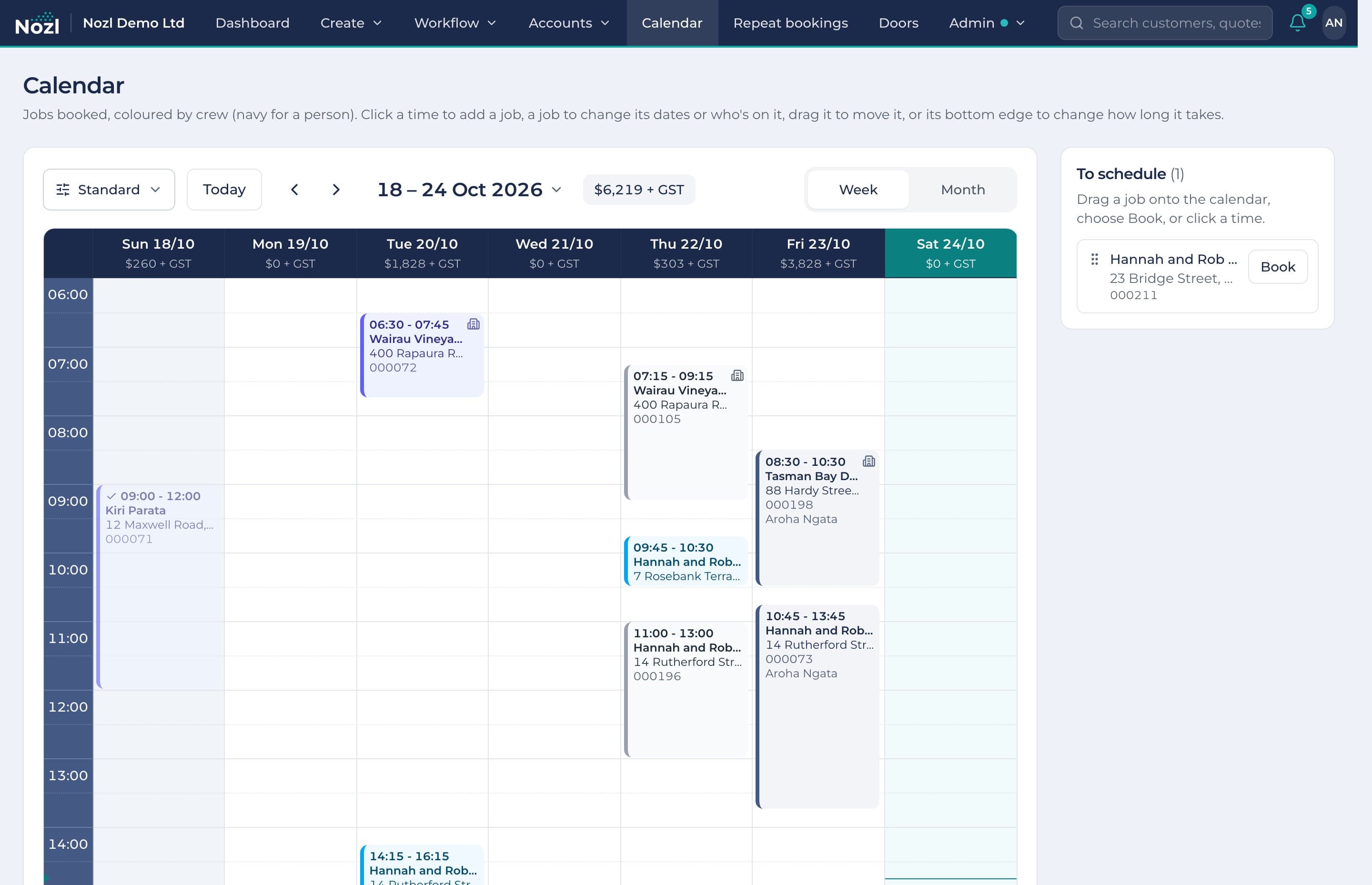 The calendar's week view, with jobs booked in each crew's colour and the value booked each day