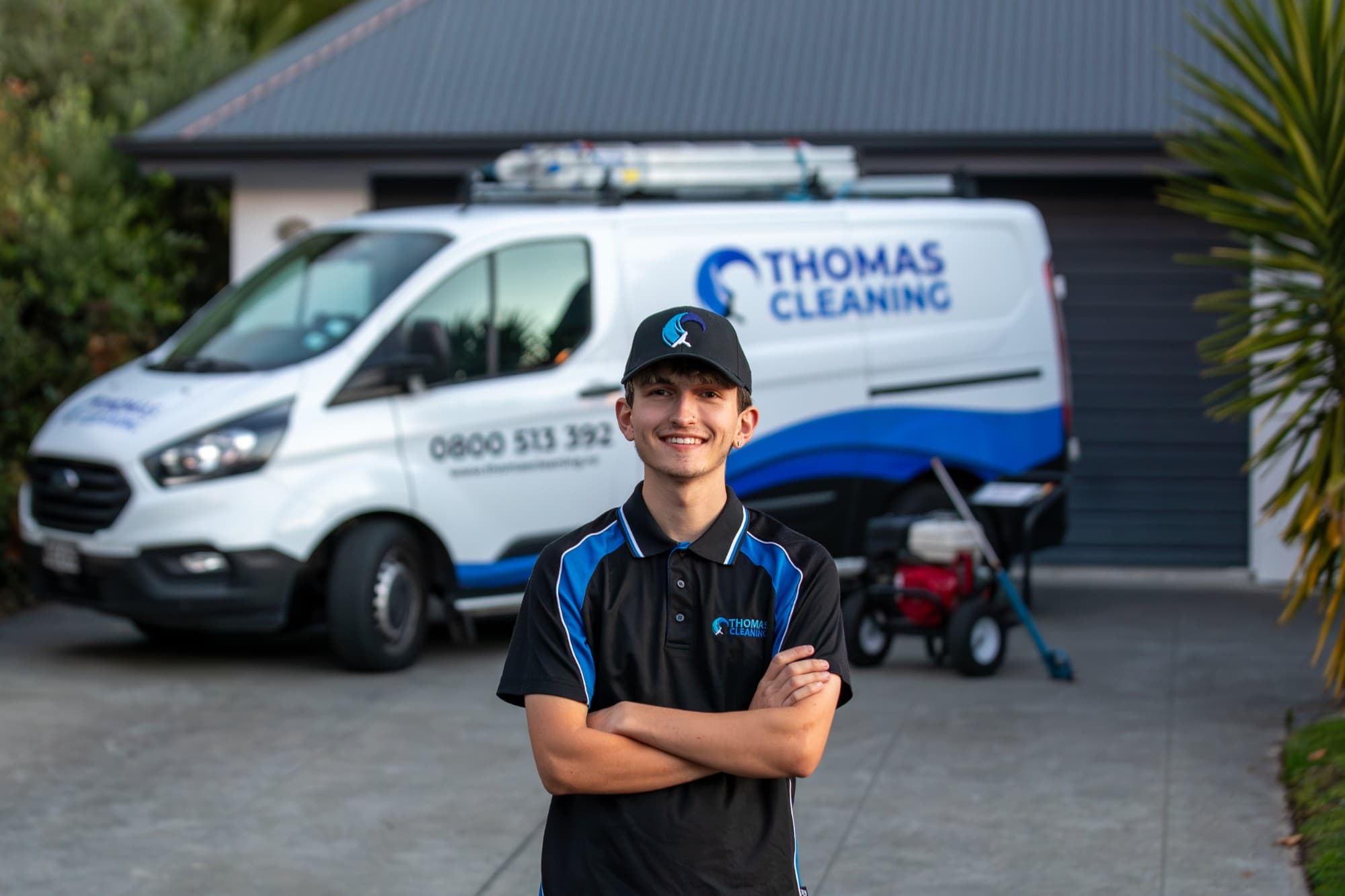 Zac Thomas of Thomas Cleaning, in front of the Thomas Cleaning van